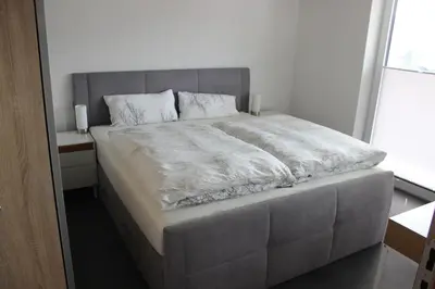 Ein Bett oder Betten in einem Zimmer der Unterkunft Apartments Patzina NEU 2024 - Kurort Oberwiesenthal
