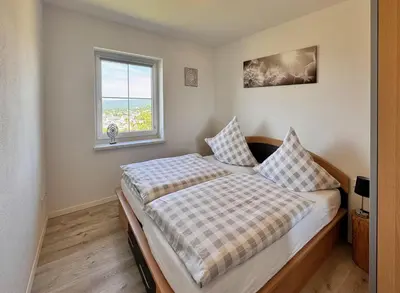 Ein Bett oder Betten in einem Zimmer der Unterkunft Ferienwohnungen Reutergut