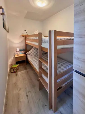 Ein Bett oder Betten in einem Zimmer der Unterkunft Ferienwohnungen Reutergut