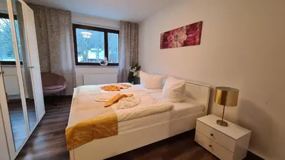 Ein Bett oder Betten in einem Zimmer der Unterkunft Ferienwohnungen Am Bühlwald