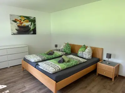Ein Bett oder Betten in einem Zimmer der Unterkunft Ferienwohnung am Rosenbach