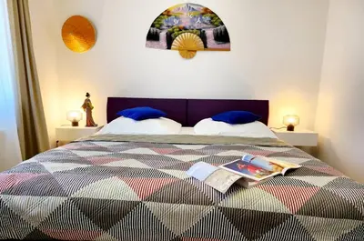 Ein Bett oder Betten in einem Zimmer der Unterkunft M & M Serviced Apartment