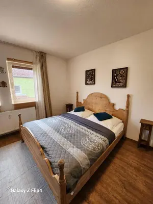 Ein Bett oder Betten in einem Zimmer der Unterkunft M & M Serviced Apartment