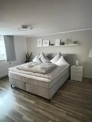Ein Bett oder Betten in einem Zimmer der Unterkunft Ferienwohnung Käsbauer Steinberg am See