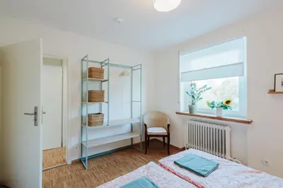 Ein Bett oder Betten in einem Zimmer der Unterkunft FerienWohnenSieglinde