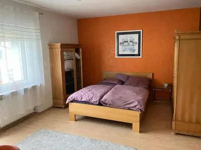 Ein Bett oder Betten in einem Zimmer der Unterkunft Ferienwohnung Fichtelberg