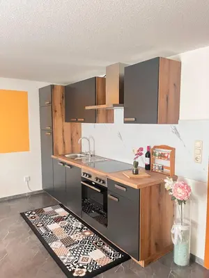 Küche/Küchenzeile in der Unterkunft S4 City Center Bayreuth Balkonwohnung mit Klima