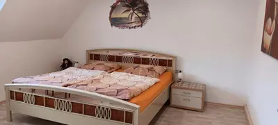 Ein Bett oder Betten in einem Zimmer der Unterkunft Ferienwohnung Eiblmaier