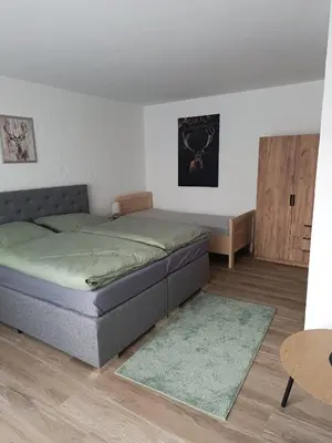 Ein Bett oder Betten in einem Zimmer der Unterkunft Gästehaus am Schlossberg