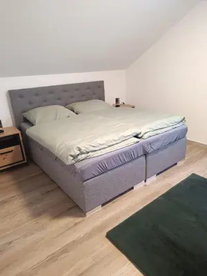 Ein Bett oder Betten in einem Zimmer der Unterkunft Gästehaus am Schlossberg