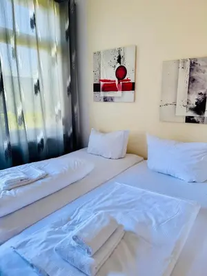 Ein Bett oder Betten in einem Zimmer der Unterkunft Siegener Balkon-Refugium