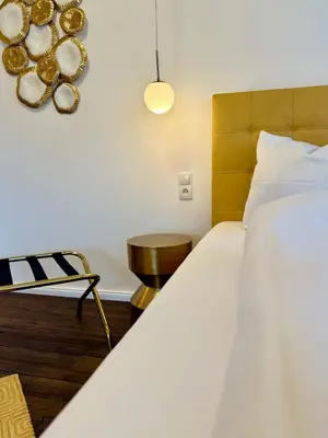 Ein Bett oder Betten in einem Zimmer der Unterkunft Hotel Villa WUN