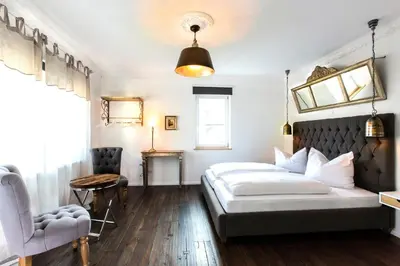 Ein Bett oder Betten in einem Zimmer der Unterkunft Hotel Villa WUN