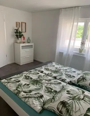 Ein Bett oder Betten in einem Zimmer der Unterkunft Ferienwohnung König