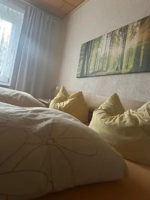 Ein Bett oder Betten in einem Zimmer der Unterkunft Ferienhaus Elsterblick