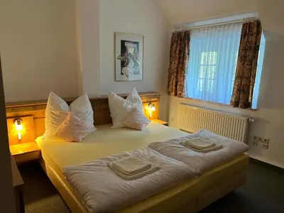 Ein Bett oder Betten in einem Zimmer der Unterkunft Attikos Hotel & Restaurant