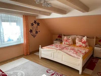 Ein Bett oder Betten in einem Zimmer der Unterkunft Ferienhaus Ochsenkopfblick