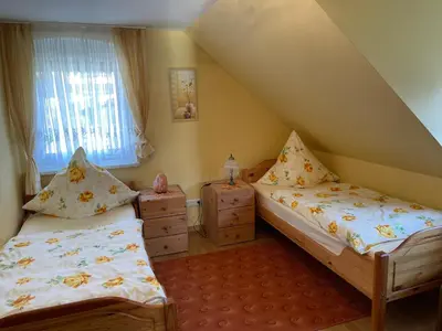 Ein Bett oder Betten in einem Zimmer der Unterkunft Ferienhaus Ochsenkopfblick