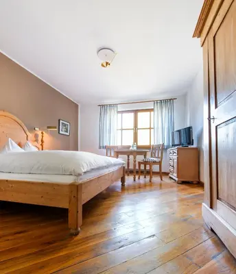 Ein Bett oder Betten in einem Zimmer der Unterkunft Gasthof Alex