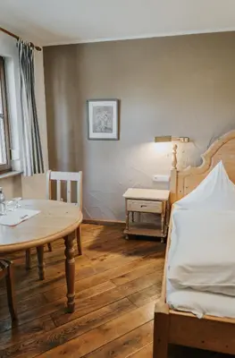 Ein Bett oder Betten in einem Zimmer der Unterkunft Gasthof Alex