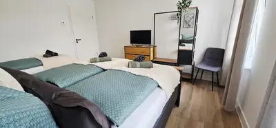 Ein Bett oder Betten in einem Zimmer der Unterkunft Lace Apartments Stilvoll in der Spitzenstadt Plauen