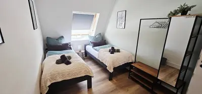 Ein Bett oder Betten in einem Zimmer der Unterkunft Lace Apartments Stilvoll in der Spitzenstadt Plauen