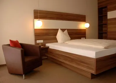 Ein Bett oder Betten in einem Zimmer der Unterkunft Brauereigasthof Püttner