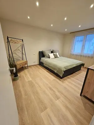 Ein Bett oder Betten in einem Zimmer der Unterkunft Zu Gast im Goldparadies, Ferienwohnung
