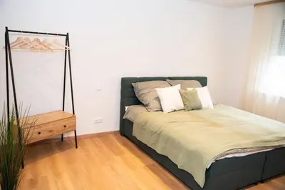Ein Bett oder Betten in einem Zimmer der Unterkunft Zu Gast im Goldparadies, Ferienwohnung