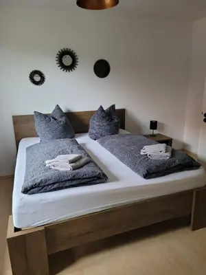 Ein Bett oder Betten in einem Zimmer der Unterkunft Rosenhof