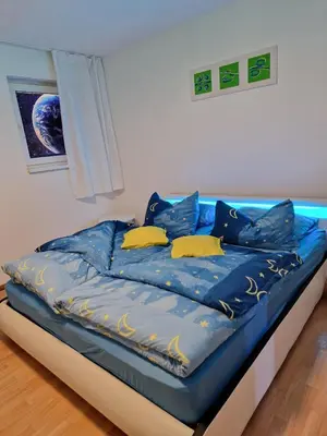 Ein Bett oder Betten in einem Zimmer der Unterkunft Ferienwohnung Esther