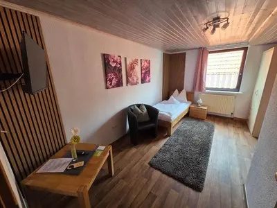 Ein Bett oder Betten in einem Zimmer der Unterkunft Pension ohne Frühstück