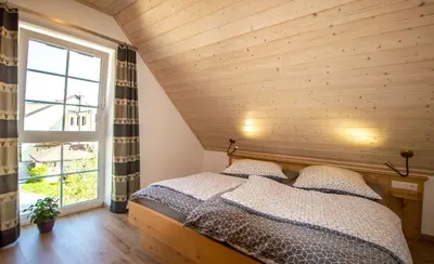 Ein Bett oder Betten in einem Zimmer der Unterkunft Ferienhaus Benedikt