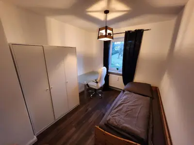 Ein Bett oder Betten in einem Zimmer der Unterkunft große moderne Unterkunft in Wunsiedel