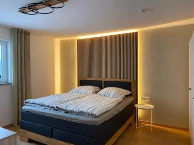 Ein Bett oder Betten in einem Zimmer der Unterkunft Ferienwohnung Wald & Wiesen