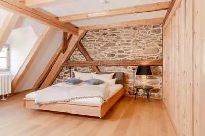Ein Bett oder Betten in einem Zimmer der Unterkunft Ferienwohnung Mühlbachgasse 9