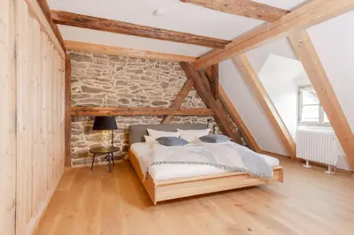 Ein Bett oder Betten in einem Zimmer der Unterkunft Ferienwohnung Mühlbachgasse 9