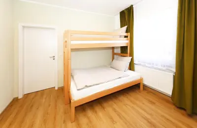 Ein Bett oder Betten in einem Zimmer der Unterkunft Hotel Erlebnis Wald