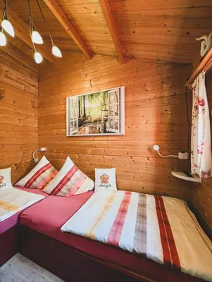 Ein Bett oder Betten in einem Zimmer der Unterkunft Ferienhaus Auszeit - Im Herzen der Natur