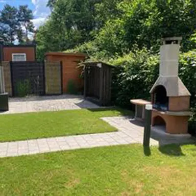 Ein Garten an der Unterkunft Mobilheim am Murner See - privater Badezuber & Grill