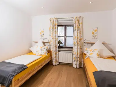 Ein Bett oder Betten in einem Zimmer der Unterkunft Ferienwohnung Speichersdorf