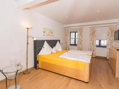 Ein Bett oder Betten in einem Zimmer der Unterkunft Ferienwohnung Speichersdorf