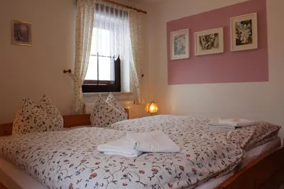 Ein Bett oder Betten in einem Zimmer der Unterkunft Pension Schanzenblick