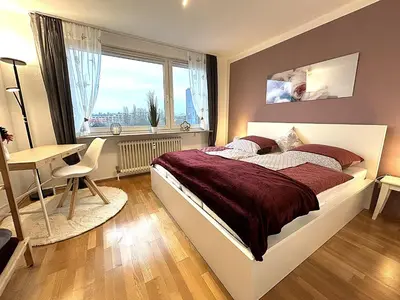 Ein Bett oder Betten in einem Zimmer der Unterkunft Gemütliches Apartment mit Balkon und Parkplatz im Zentrum