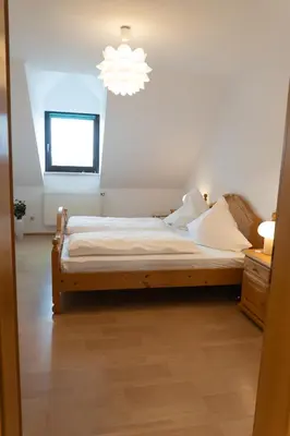Ein Bett oder Betten in einem Zimmer der Unterkunft Ferienwohnung Härtl