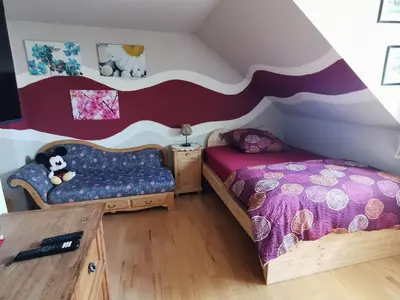 Ein Bett oder Betten in einem Zimmer der Unterkunft FeWo-AdOlTi
