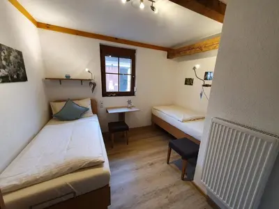Ein Bett oder Betten in einem Zimmer der Unterkunft Rennerhof-Siebeneichen Fewo Frechdachs