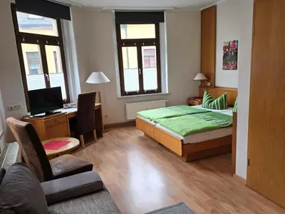 Ein Bett oder Betten in einem Zimmer der Unterkunft Pension Hotel Turmblick