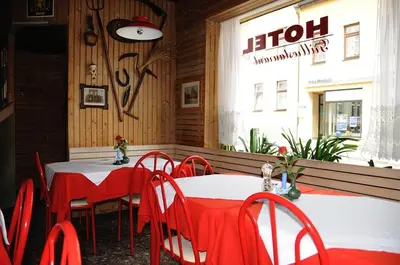 Ein Restaurant oder anderes Speiselokal in der Unterkunft Pension Hotel Turmblick