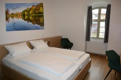Ein Bett oder Betten in einem Zimmer der Unterkunft Schloss Thurnau